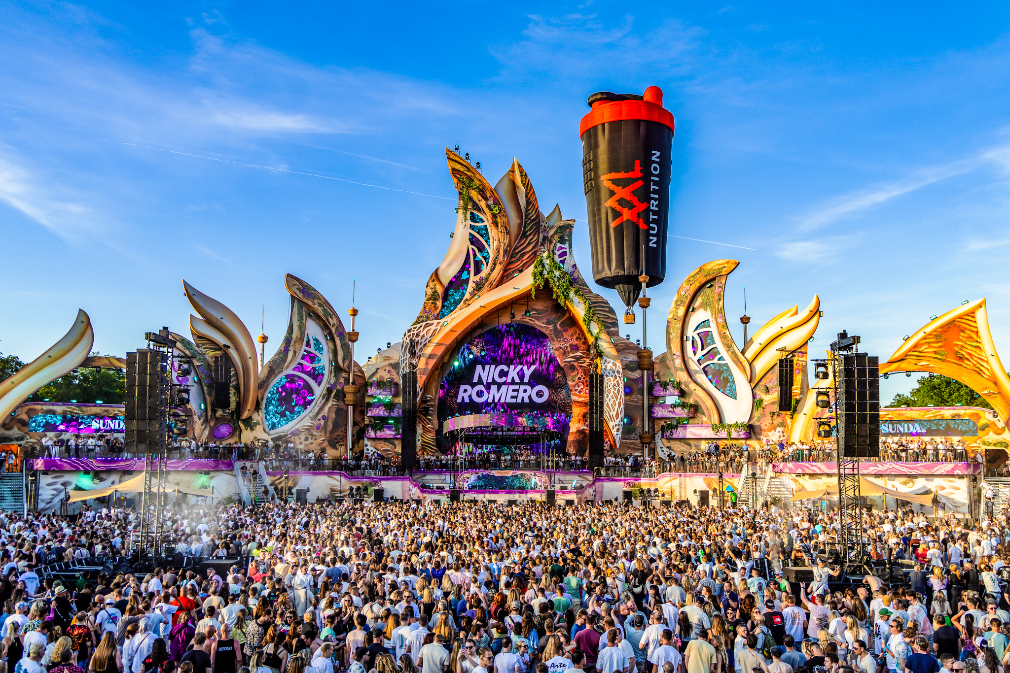 Mainstage screen showing Nicky Romero next to a giant inflatable shaker, 7th Sunday Festival 2026