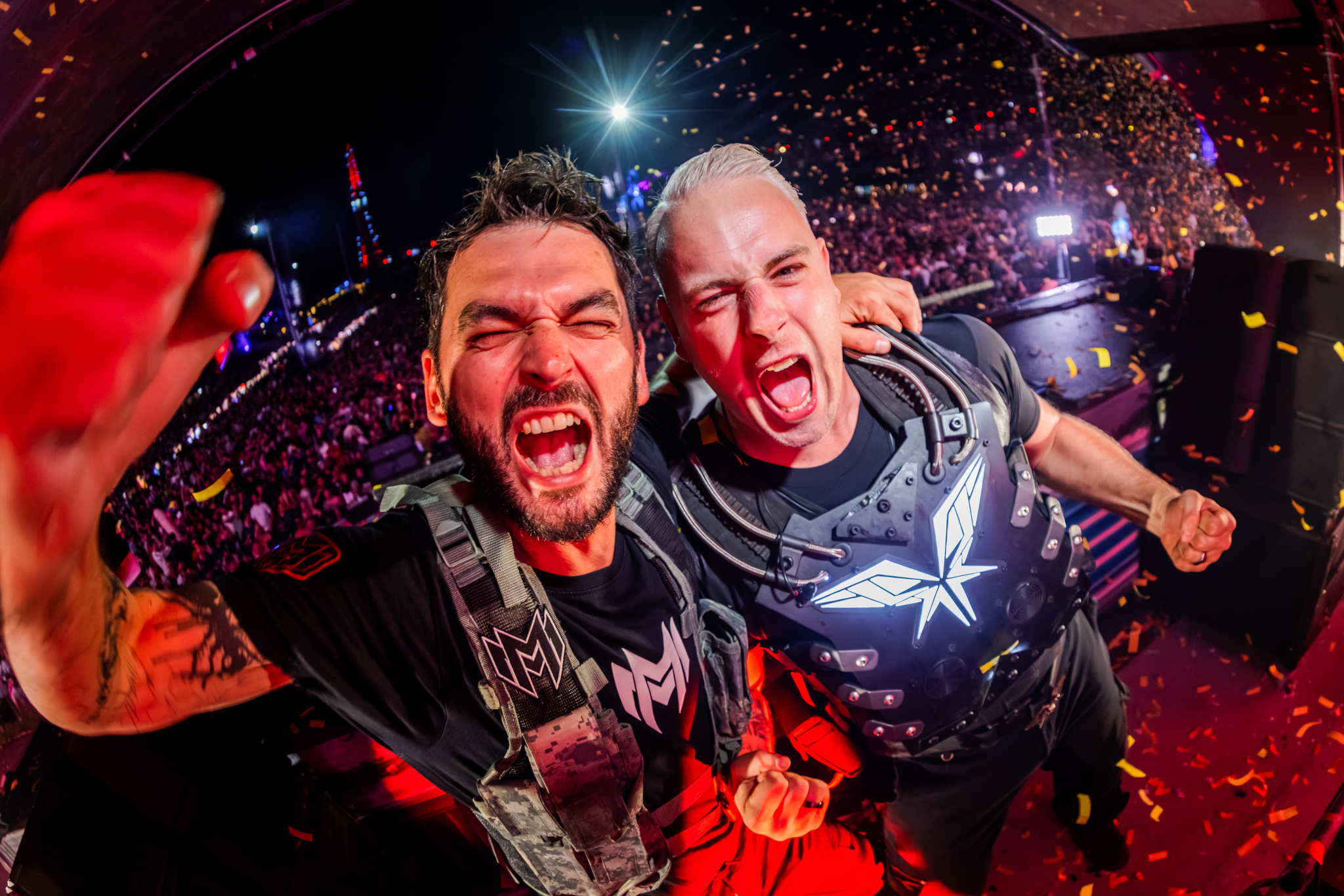 Two artists cheering into the camera on stage at Decibel Outdoor Festival 2026
