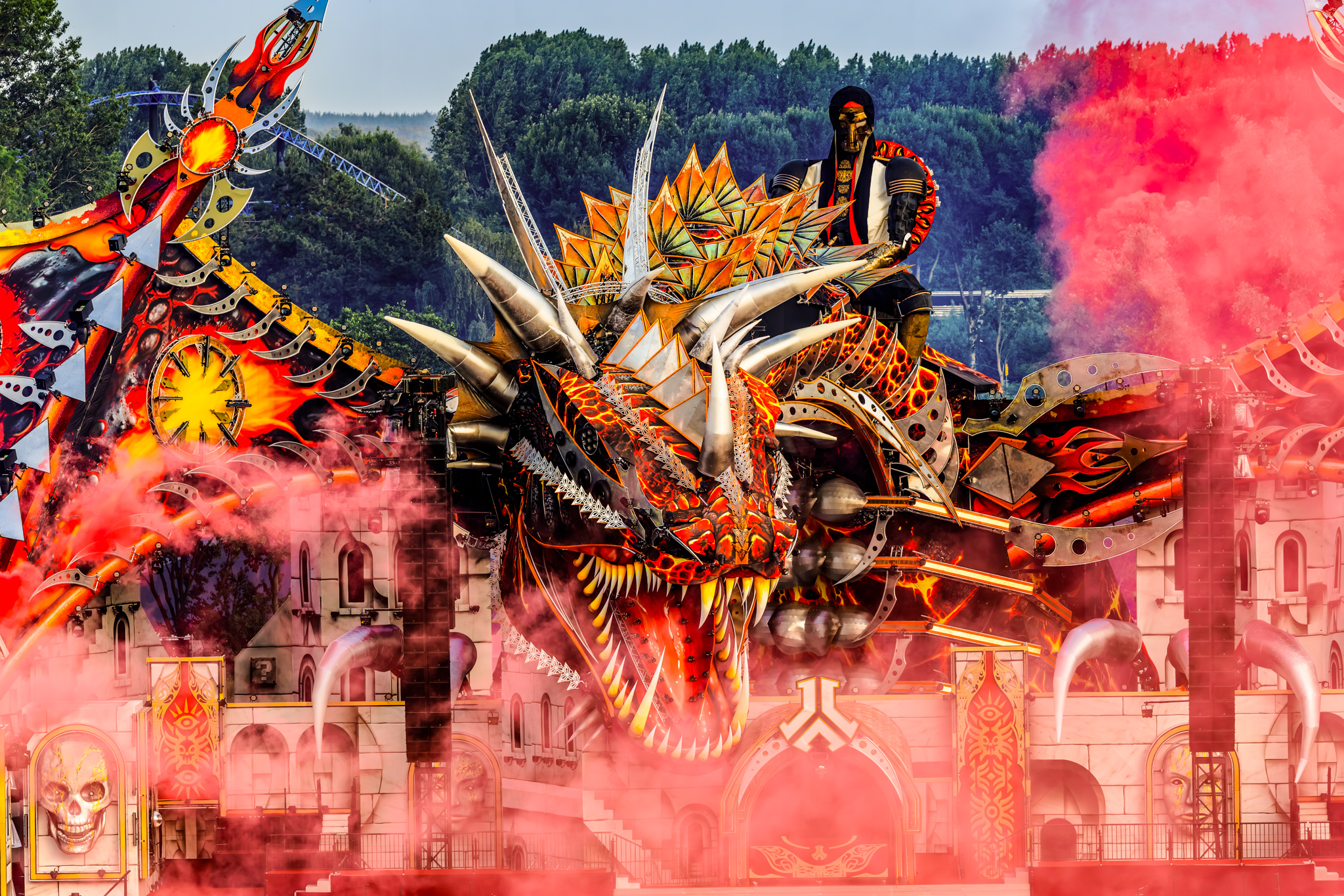 Red smoke around the dragon on the Defqon.1 2026 – Sacred Oath mainstage