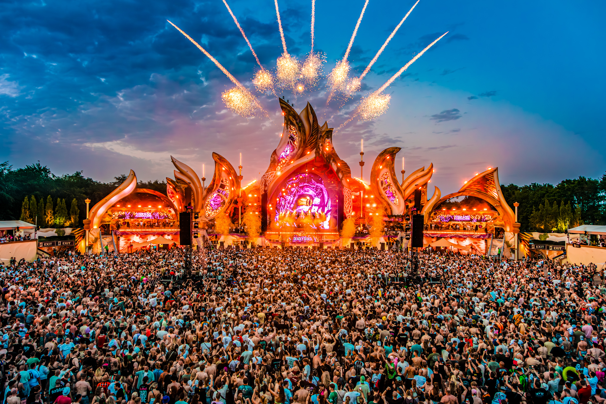 Fireworks above the golden mainstage at sunset at Harmony of Hardcore 2026