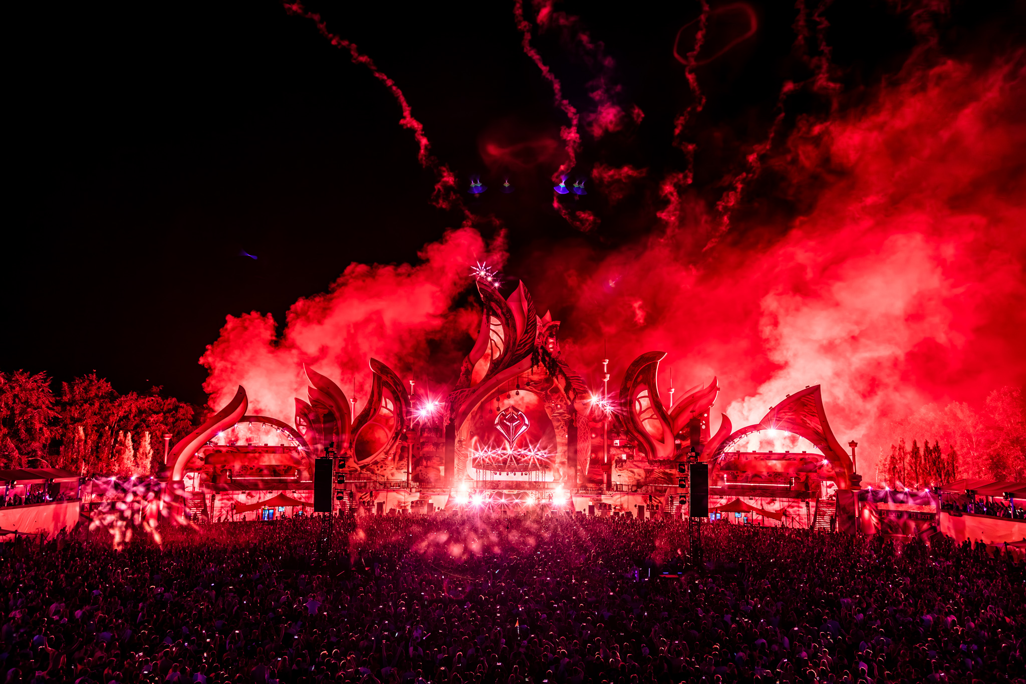 Red smoke and flares over the mainstage at night at Harmony of Hardcore 2026