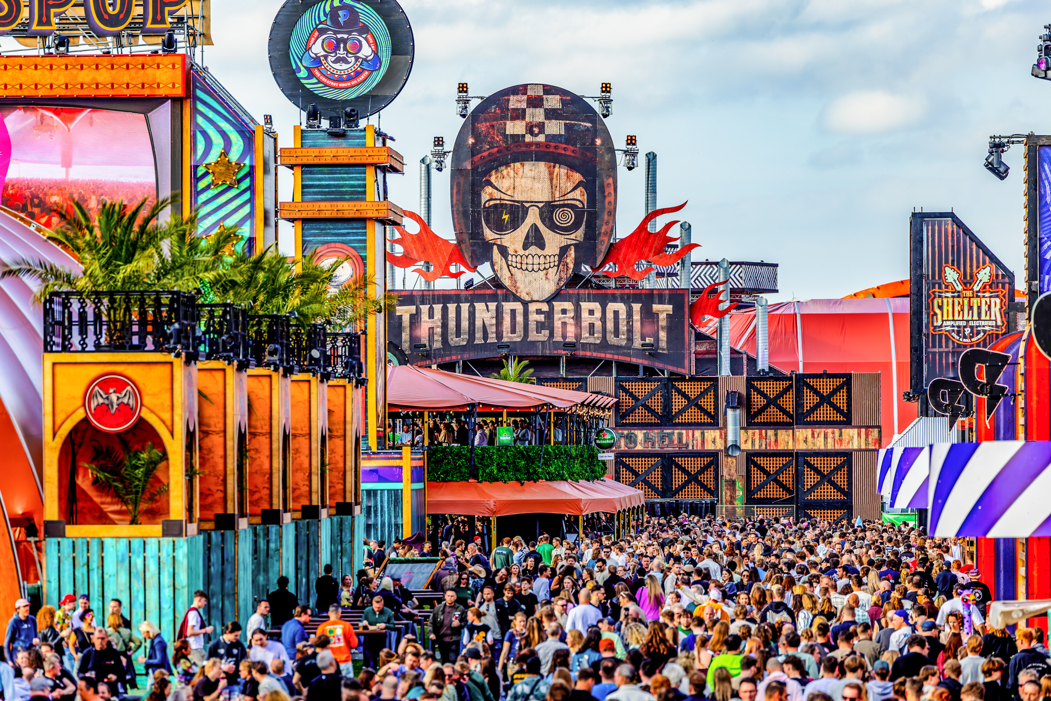 Visitors walking past the Thunderbolt skull stage at Paaspop 2026, Schijndel