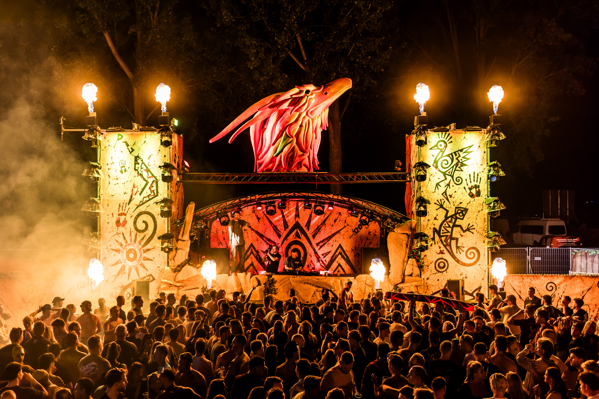 Phoenix stage lit by torches at night at Reignite Festival 2026