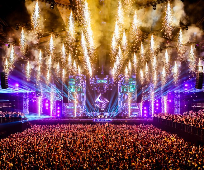 Pyro and smoke explode over the Reverze 2026 stage at the AFAS Dome, Antwerp